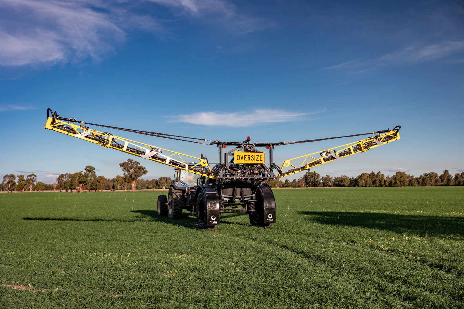 Stoll CB4 with its boom spread wide against a blue sky