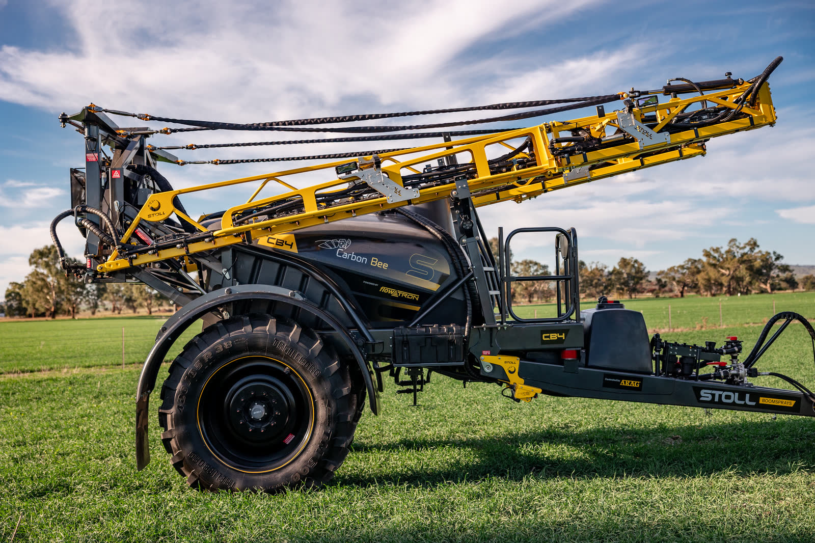 Stoll CB4 side on with its boom folded, Carbon Bee branding on the tank
