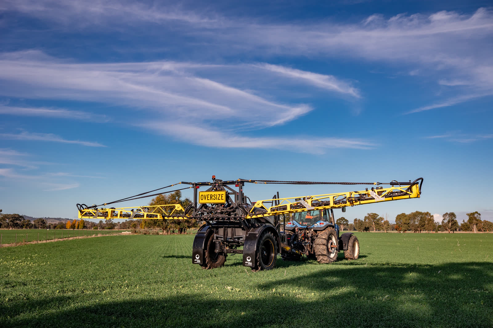 Stoll CB4 with its boom spread, from the front