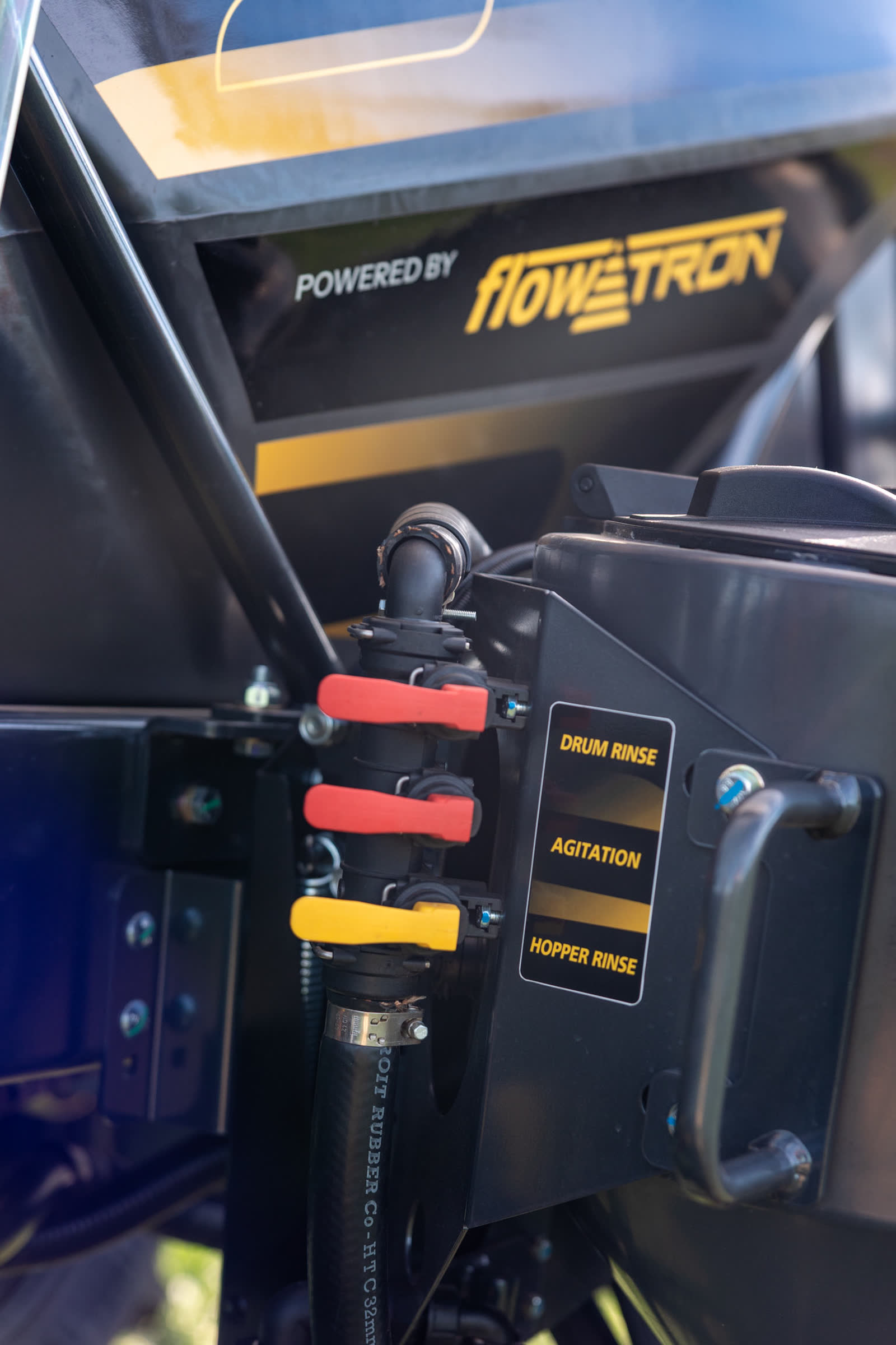 Labelled valves for drum rinse, agitation and hopper rinse on the sprayer body