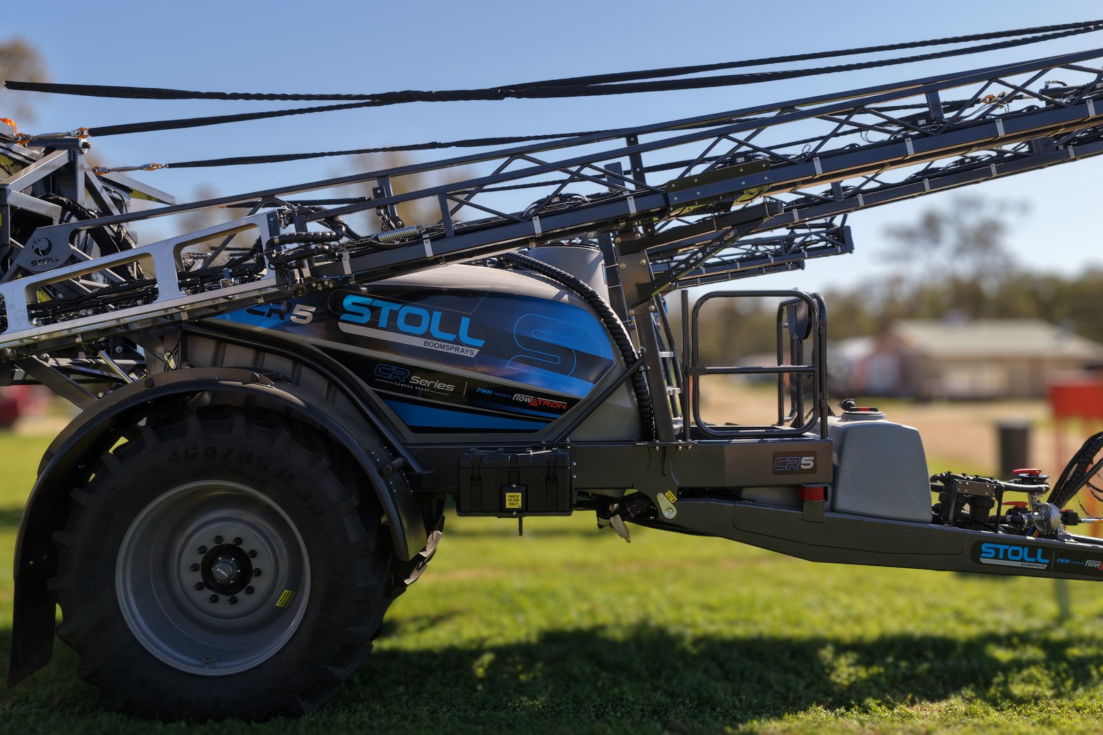 A Stoll CR5 side on with its boom folded, on the stand at the Henty Machinery Field Days