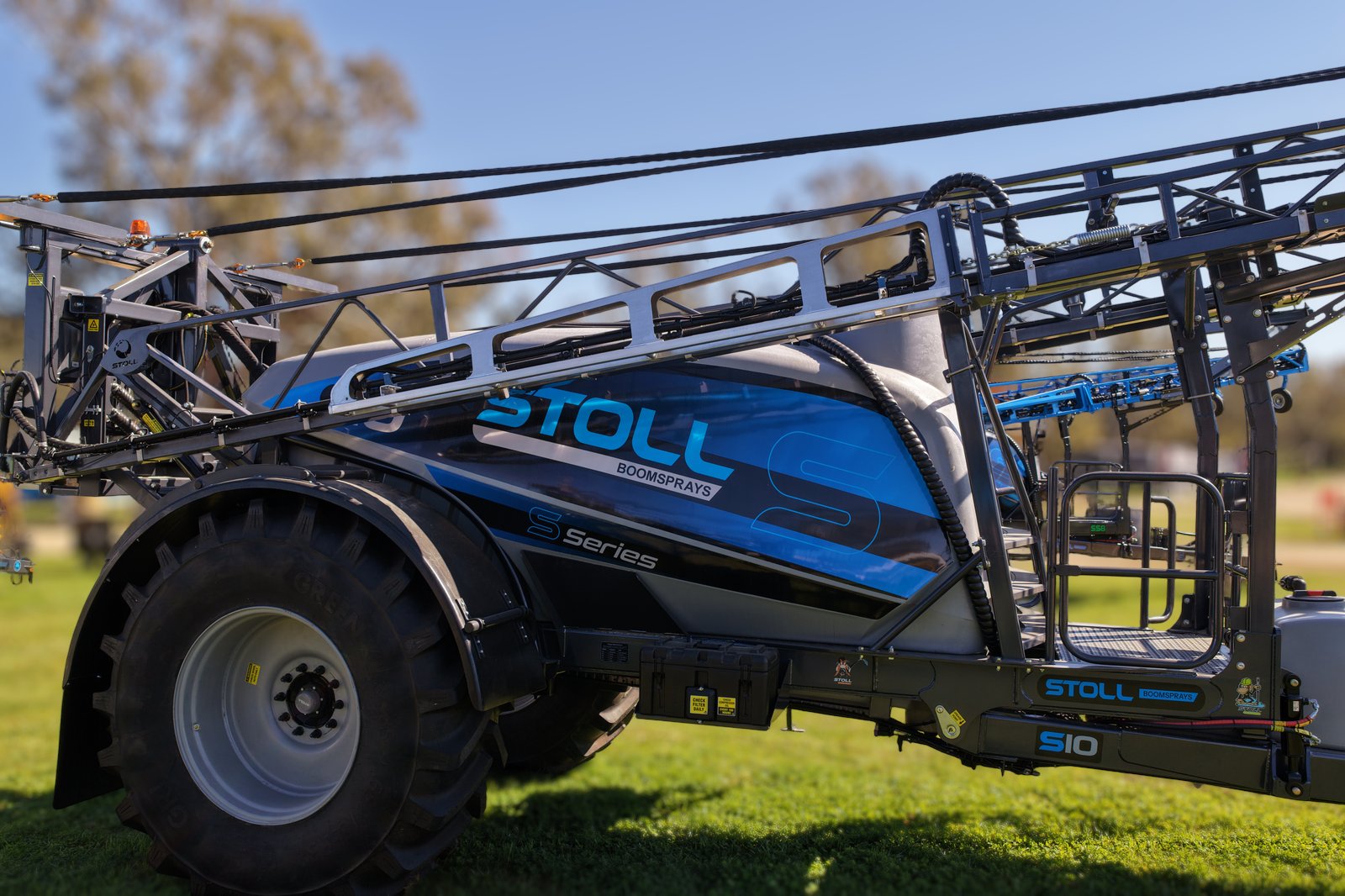 A Stoll S10 side on with its boom folded, on the stand at the Henty Machinery Field Days
