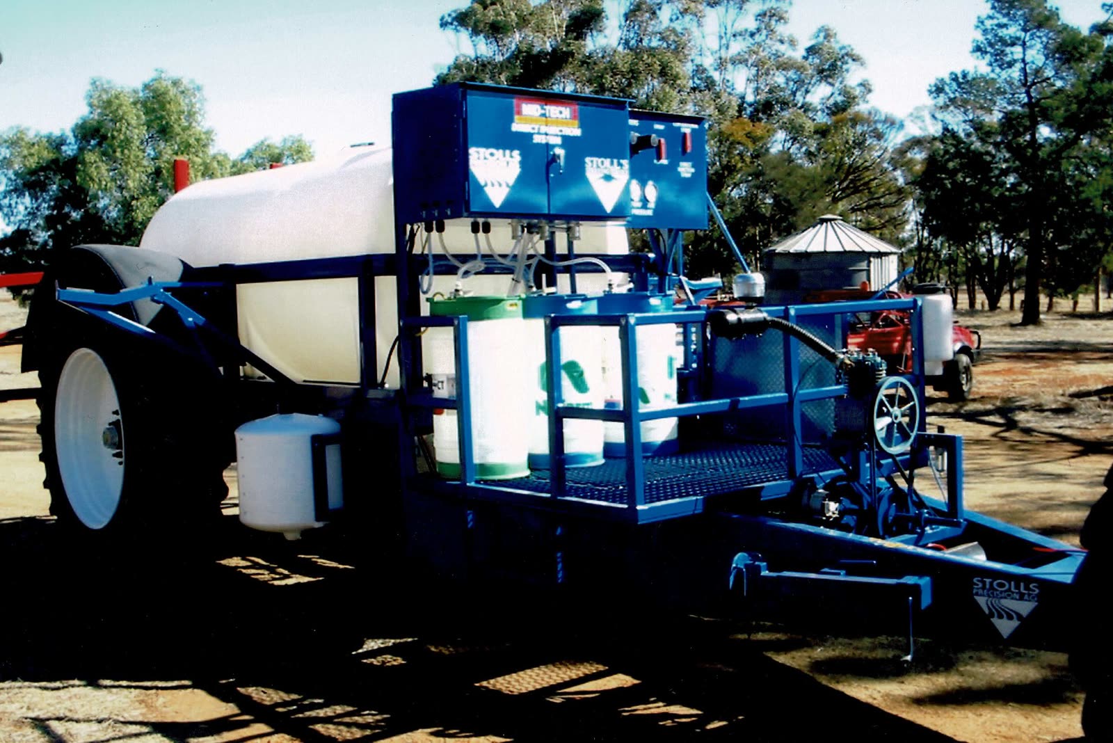 An early blue Stoll's trailed sprayer with a chemical platform and a direct injection cabinet