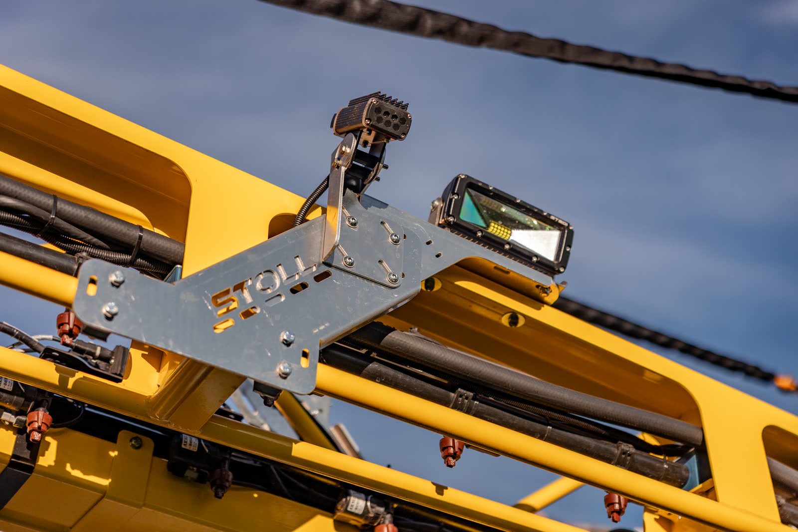 Camera bracket and boom detail on a Stoll sprayer