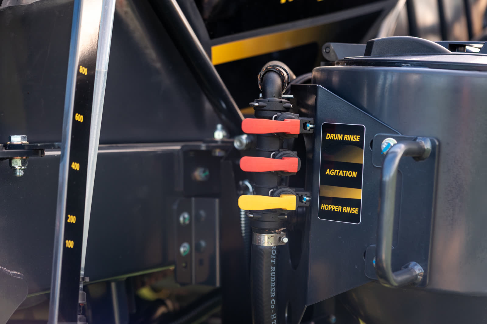 Red and yellow valve handles on a Stoll sprayer