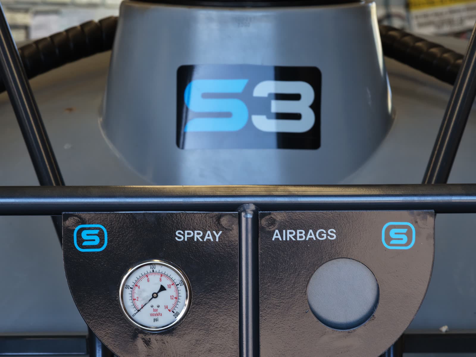 The S3 badge above the spray and airbag gauges on a Stoll S3