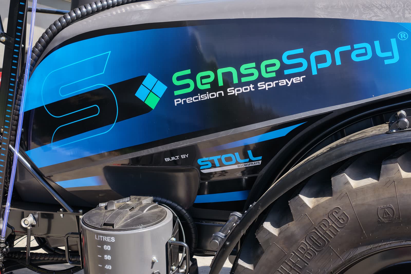 SenseSpray branding along the tank of a Stoll SS8