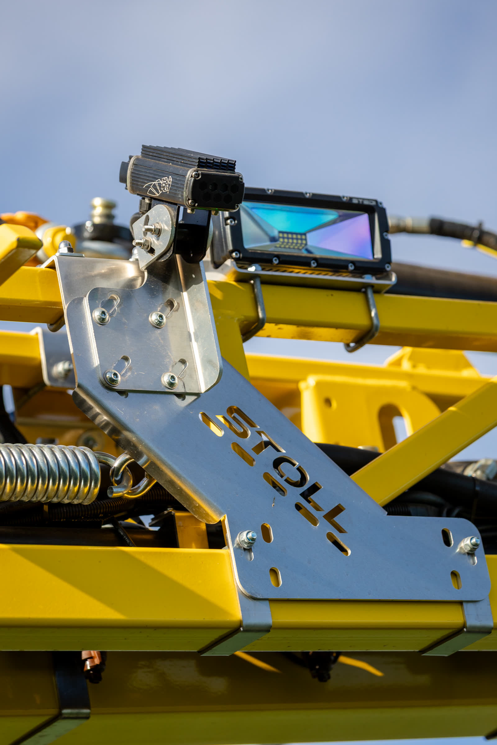 Camera and light on a Stoll-made bracket along a yellow boom