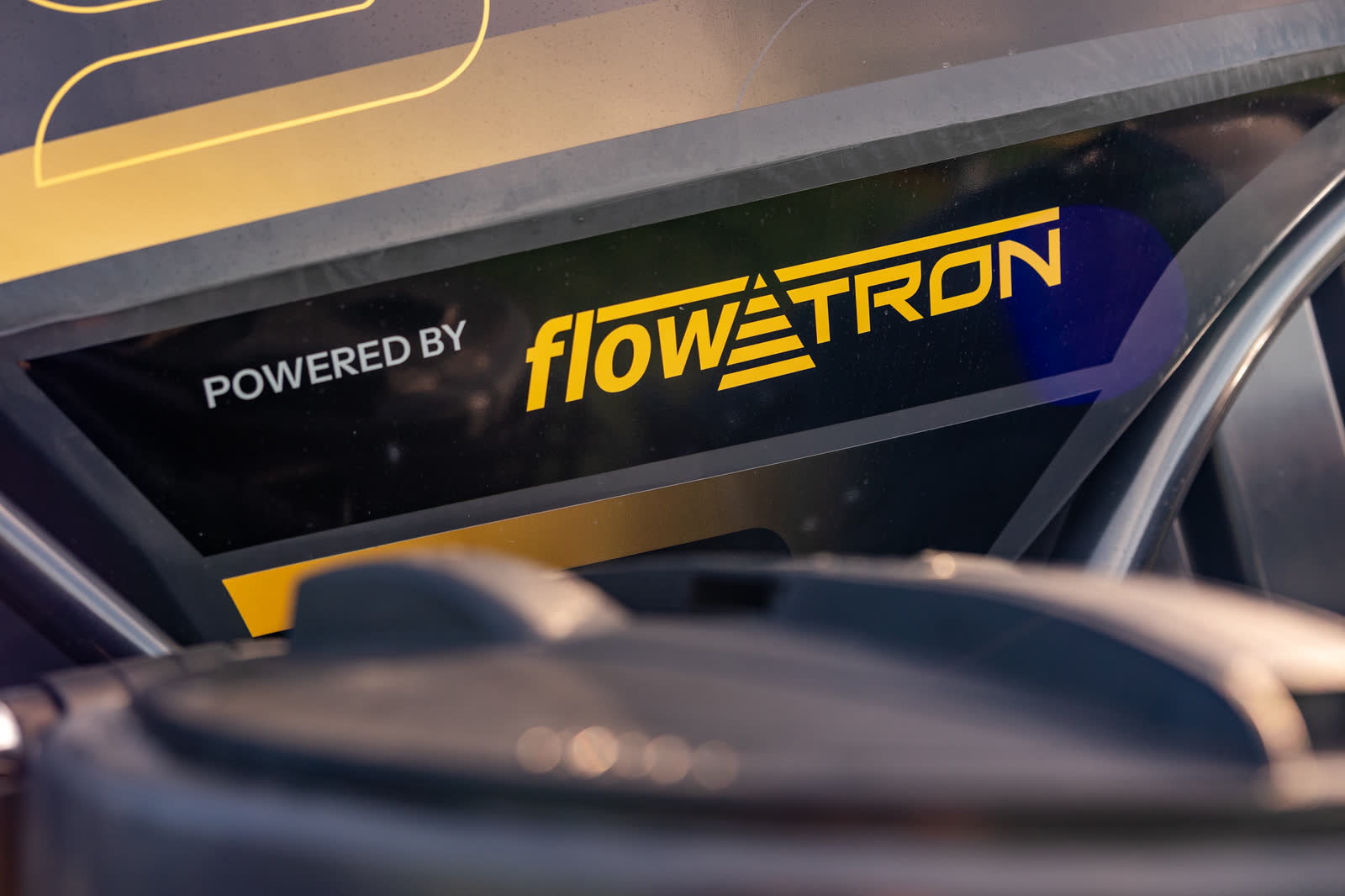 Powered by Flowtron decal on the side of a Stoll tank